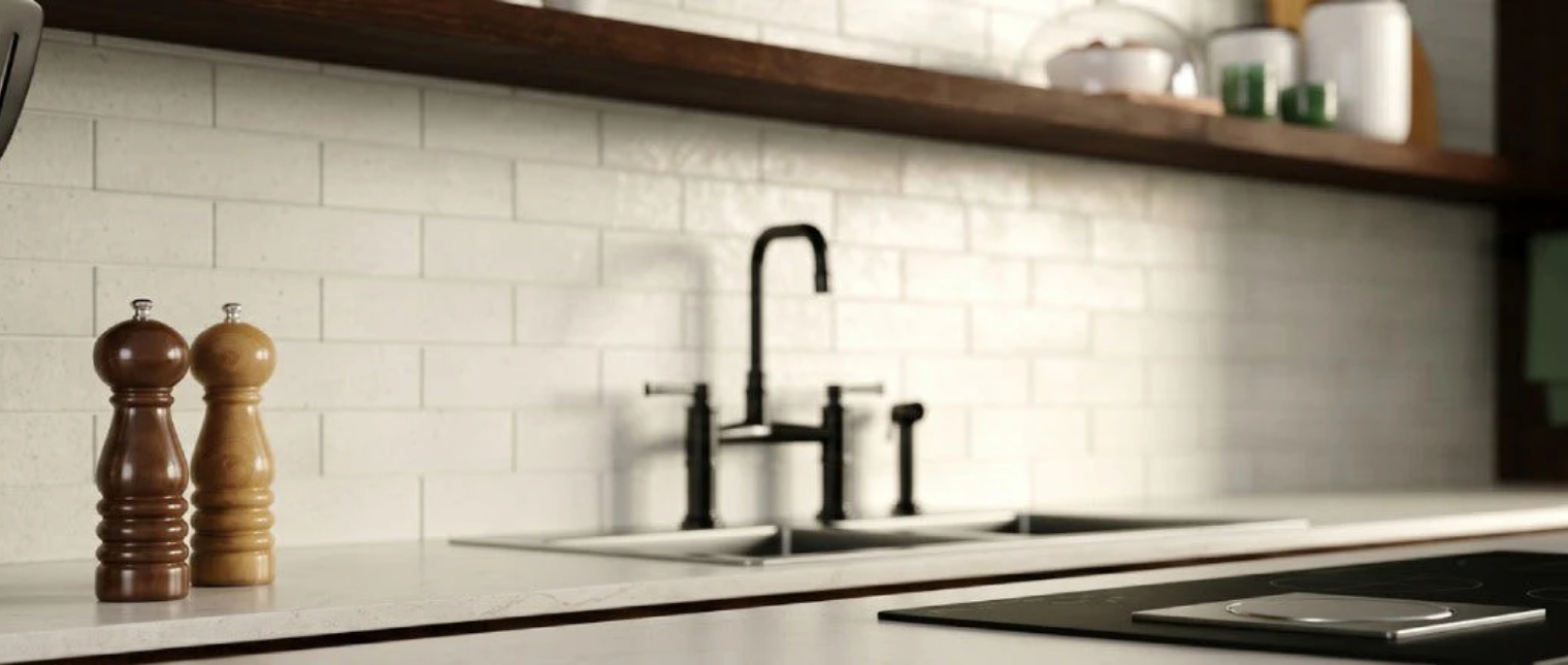 Kitchen interior utilizing Shiro matte white ceramic tile on the backsplash to create a quiet, grounded architectural surface.