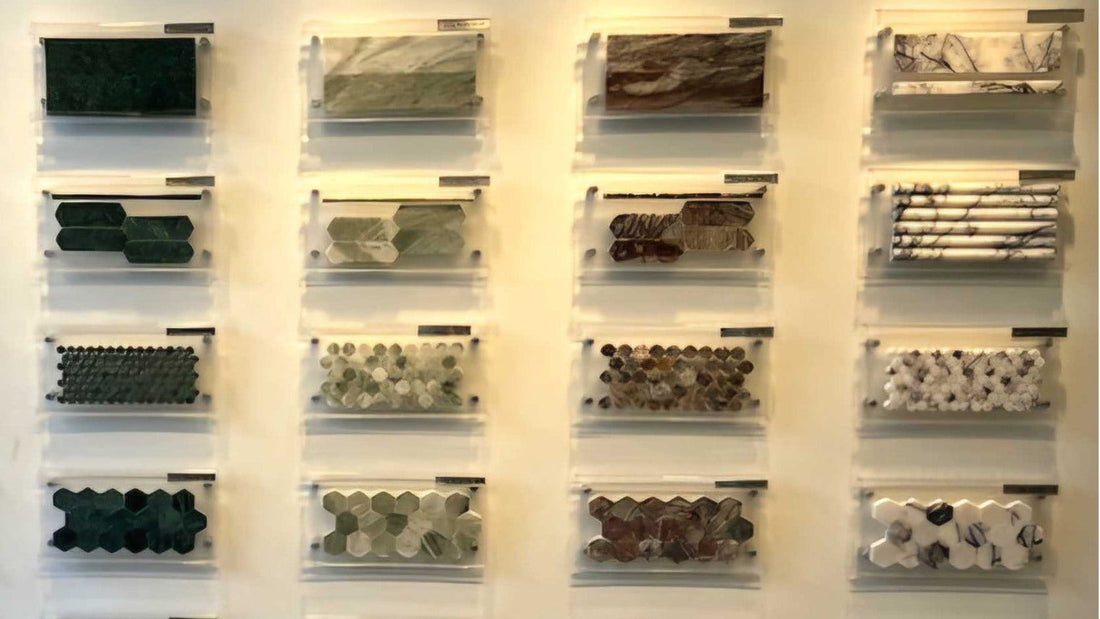  Wall display featuring various marble tile shapes and color samples.