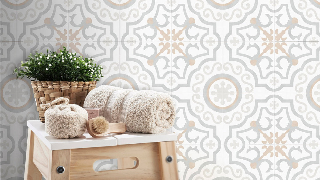 Rolled towels, basket plant, and brush on patterned tile background