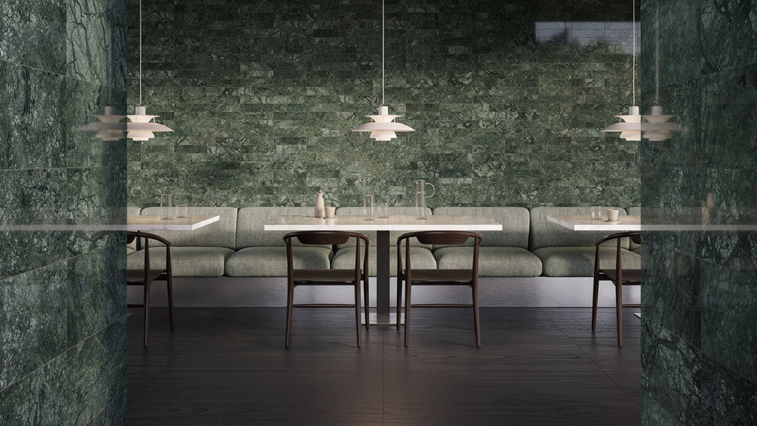 Elegant restaurant interior with green marble walls and modern lighting.