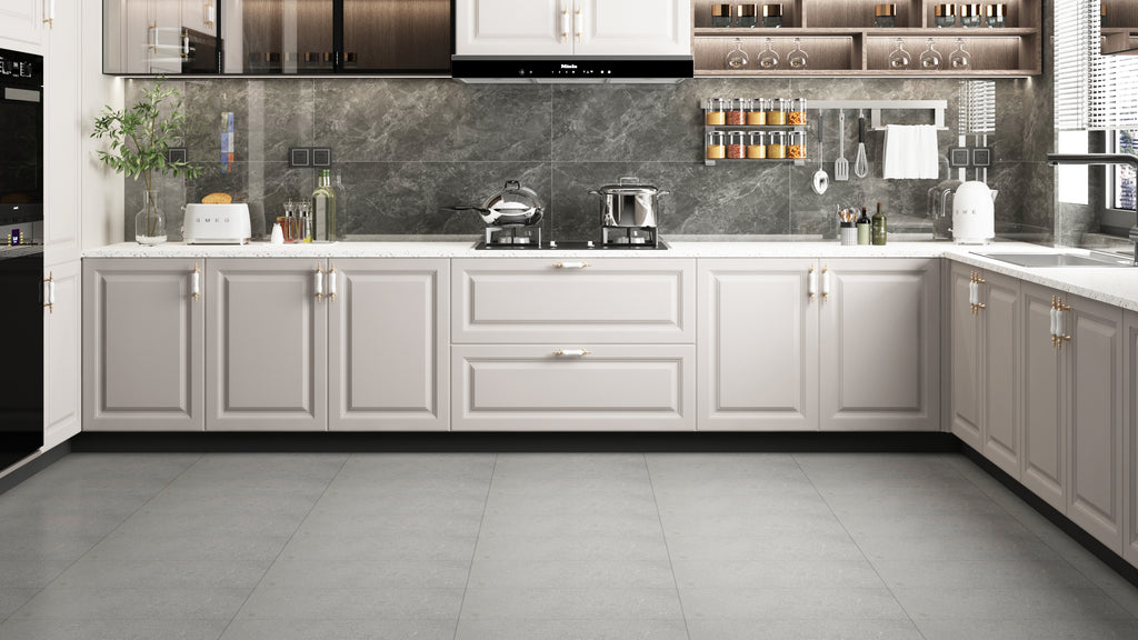 Elegant U-shaped kitchen displaying a glossy dark stone backsplash, grey floor tiles, and beige traditional cabinetry.