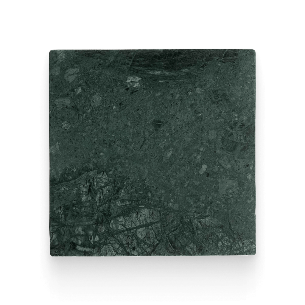 Square piece of dark green stone on a white background