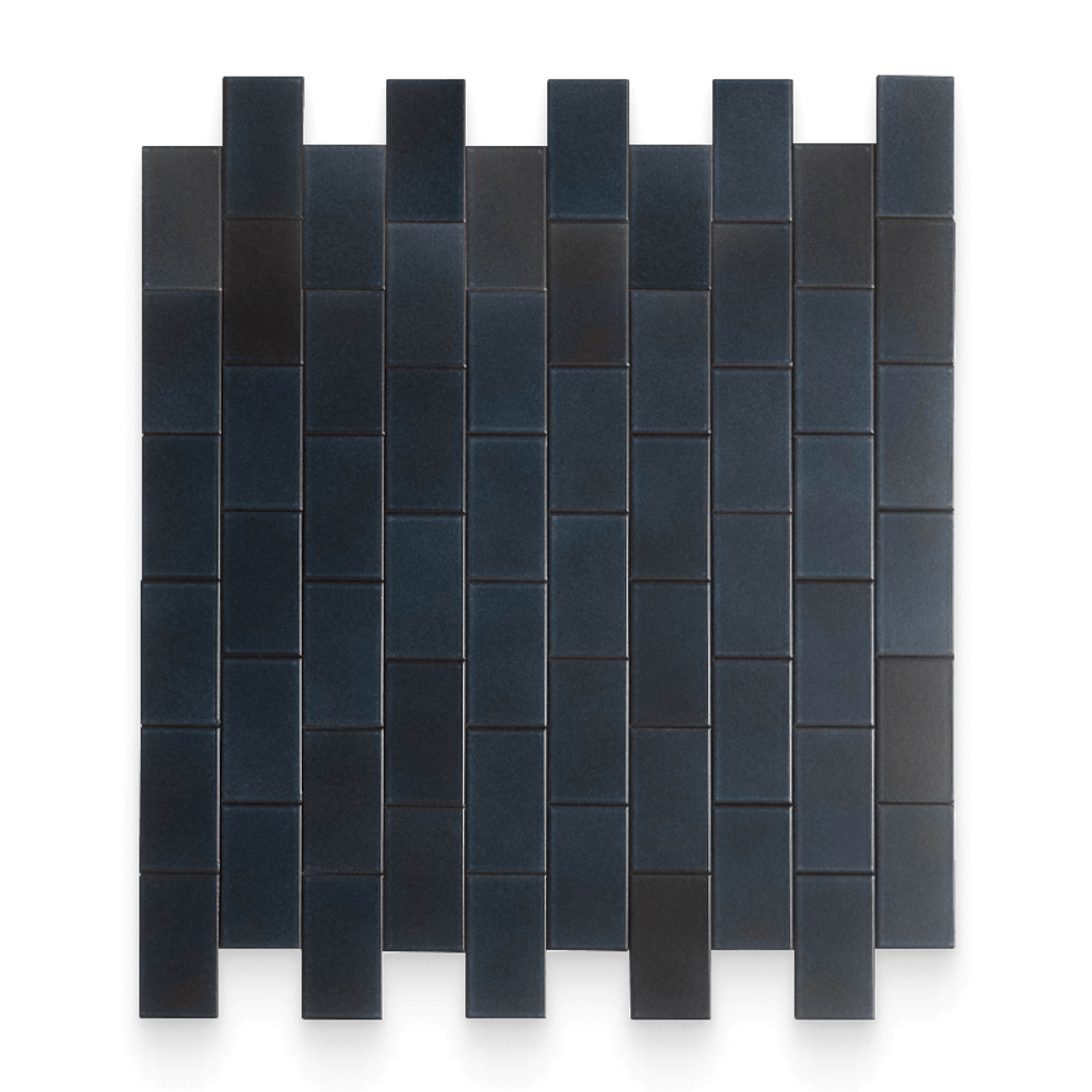 Black rectangular tiles arranged in a pattern on a white background