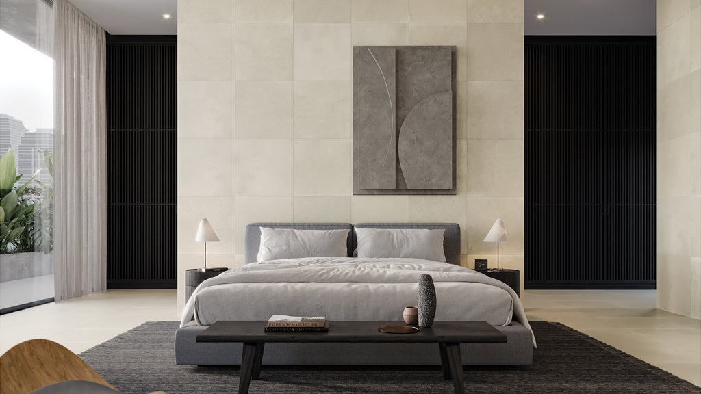 Luxury master bedroom displaying large beige porcelain wall and floor tiles paired with grey bedding and black accents.